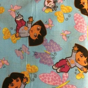Dora the Explorer on Blue 100% Cotton Fabric Remnant 12&quot;x44&quot; piece Sold by the Piece