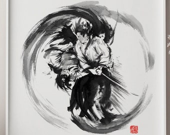 May include: Black and white ink painting of two figures in a circular motion, resembling a martial arts pose. The painting is framed in a white frame and displayed on a white wall.
