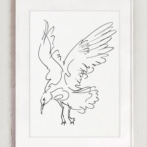 May include: A framed black and white line drawing of a seagull in flight. The bird is depicted with outstretched wings and a downward gaze, captured in a minimalist style. The artwork is set against a white background.