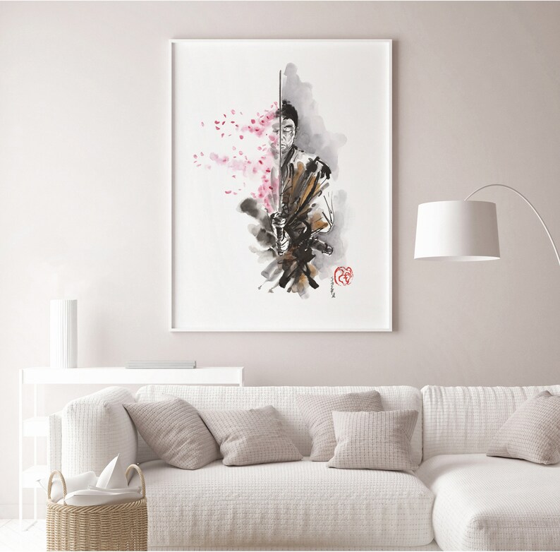 May include: Framed watercolor art print featuring a samurai warrior with a katana, set against a backdrop of cherry blossoms. The artwork uses a palette of black, brown, and pink hues, with a red seal in the lower right corner. The print is displayed in a white frame.