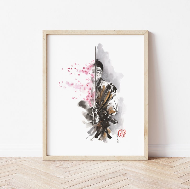 May include: Watercolor print of a samurai holding a katana, with cherry blossoms on the left side. The artwork features a blend of black, brown, and pink hues, framed in a light wood frame. The art piece is a depiction of Japanese culture.