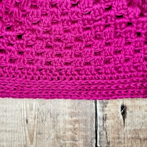 A closeup photo of the Miriam crochet granny hat, perfect for use as a chemo hat for cancer patients. The DIY handmade crochet hat pattern is a fashionable choice for those going through chemotherapy.