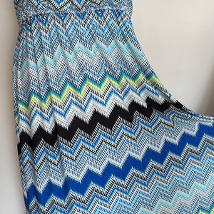 May include: A sleeveless maxi dress with a blue, black, white, and yellow chevron pattern.