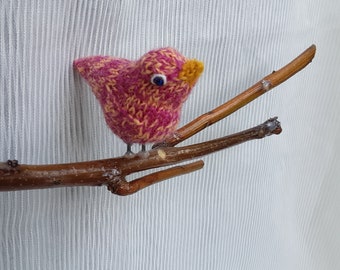 E. Birds on a Branch, hanging mobiles with variations of tiny knitted birds perched atop rustic wooden branch