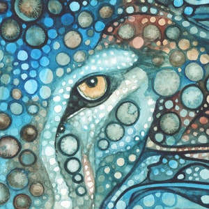 May include: A watercolour painting of an animal eye, in shades of blue, brown, and white. The eye is a warm yellow-orange colour, with a black outline. The artwork has a spotted pattern and a textured appearance.