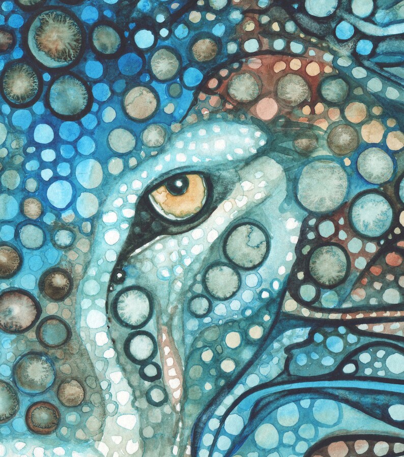 May include: A watercolour painting of an animal eye, in shades of blue, brown, and white. The eye is a warm yellow-orange colour, with a black outline. The artwork has a spotted pattern and a textured appearance.