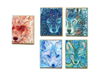 May include: Set of six greeting cards featuring watercolor illustrations of animal faces. The cards feature a fox, a wolf, and four different wolves with blue and green patterns.