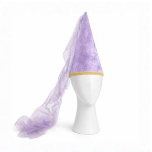 A white mannequin head wearing a purple cone-shaped hat with a long, flowing purple fabric draped over the side.