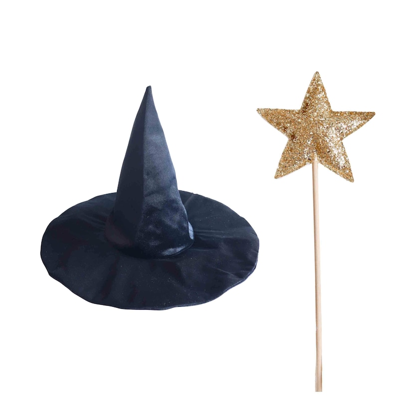 A black witch's hat and a gold glitter star on a stick are shown against a white background.