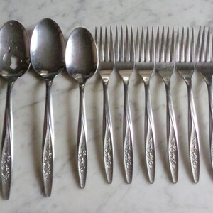 thumbnail image 2 of International Silver Spring Lily Stainless Steel Flatware – Glossy Finish, CHOICE Pattern – Used 2 of 6