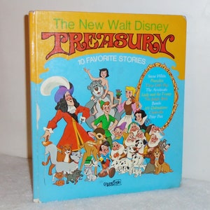 May include: A yellow, blue, and red book cover with the title "The New Walt Disney Treasury" and the subtitle "10 Favorite Stories". The cover features illustrations of characters from various Disney movies, including Snow White, Pinocchio, The Aristocats, Lady and the Tramp, The Jungle Book, Bambi, 101 Dalmatians, Cinderella, and Peter Pan.