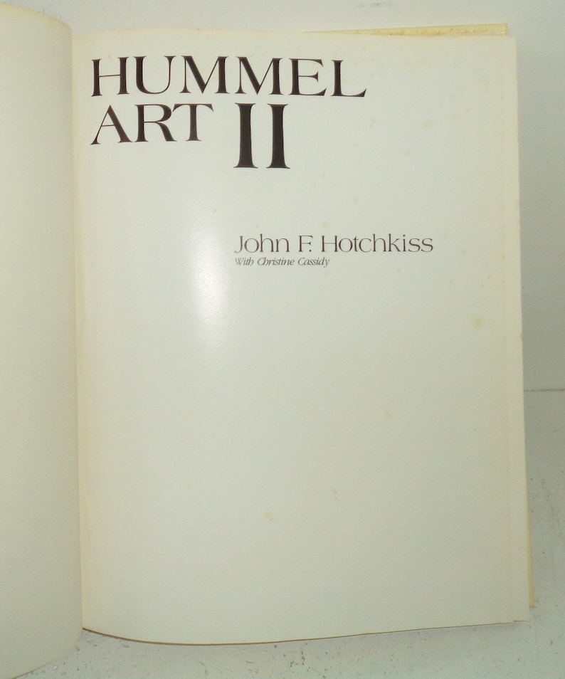 May include: Book cover with the title "Hummel Art II" by John F. Hotchkiss with Christine Cassidy.
