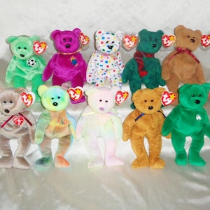 May include: A collection of plush teddy bears in various colors, including green, pink, and brown. Each bear has a tag attached. Some bears have additional details like a soccer ball or a scarf.