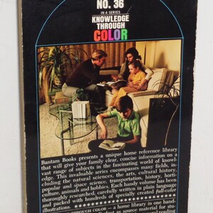 May include: A book cover featuring a family reading together in a living room. The cover is black with a blue, green, red, and yellow title: "Knowledge Through Color." The book is number 36 in a series. The text on the back of the book describes the book as a home reference library.