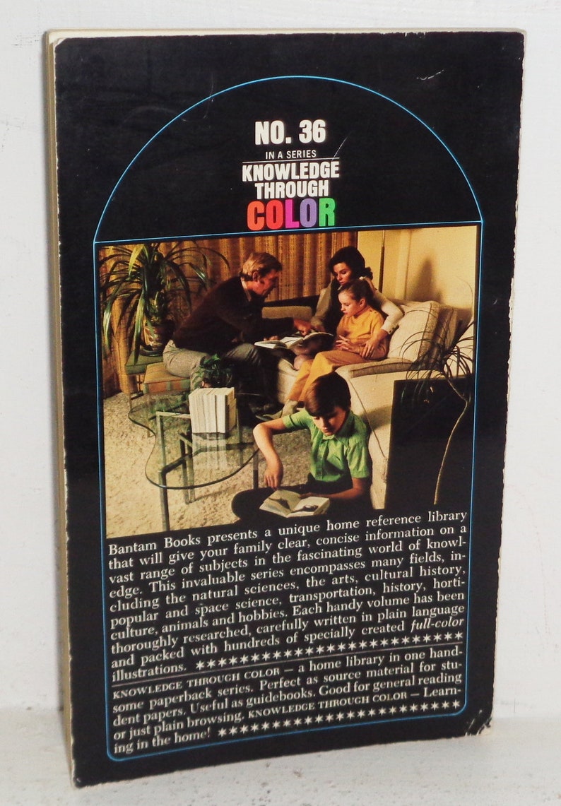 May include: A book cover featuring a family reading together in a living room. The cover is black with a blue, green, red, and yellow title: "Knowledge Through Color." The book is number 36 in a series. The text on the back of the book describes the book as a home reference library.