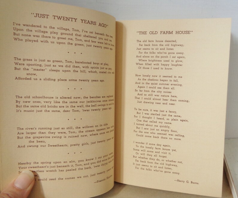 May include: A vintage book with two poems titled "Just Twenty Years Ago" and "The Old Farm House". The poems are printed on yellowed paper with black text. The poems are about nostalgia and remembering the past.