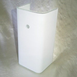 May include: A white ceramic mug with a black handle and the text "But First, Coffee" in a handwritten style. The mug is on a white surface. The mug is approximately 4 inches tall.