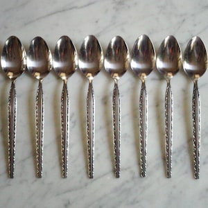 Stainless Steel Korea Unknown Scroll pattern 6 3/4 inch 8 Teaspoons