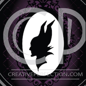 May include: A black silhouette of a woman with horns and a pointed hat in a white oval frame. The frame is ornate and has a black and purple background with a repeating pattern of crowns.