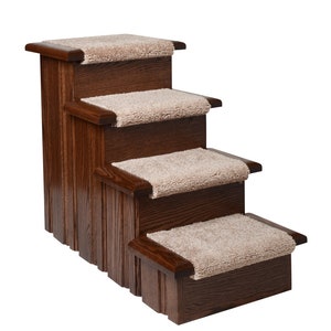 May include: Four-step pet stairs made of dark wood with a carpeted surface on each step. The stairs are angled to the right.
