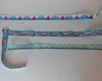 May include: Three blue and white ribbon trims with different nautical themed patterns. The top trim features anchors and sailboats. The middle trim features sailboats, fish, and life preservers. The bottom trim features sailboats and suns.