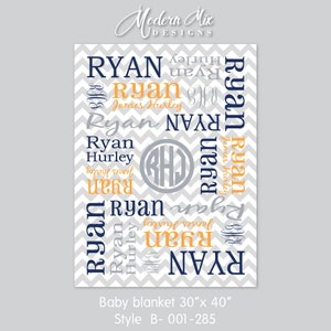 May include: A gray and white chevron patterned baby blanket with the name "Ryan" repeated in navy blue and orange lettering. The blanket also features a gray circle with the initials "RHJ" in white.