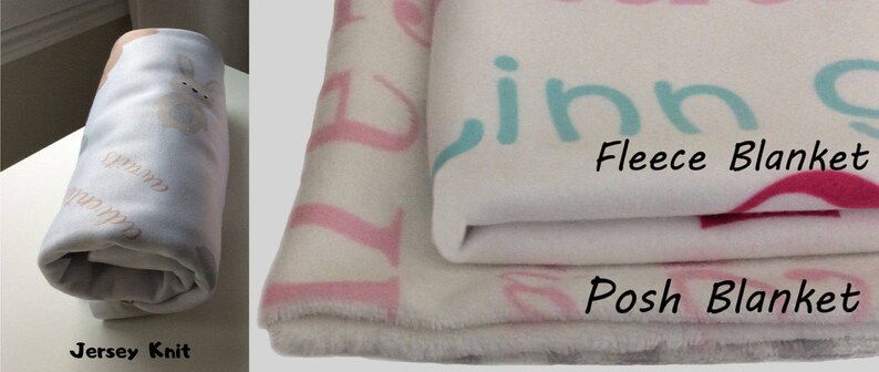 May include: Three different types of blankets: a white jersey knit blanket, a white fleece blanket with pink and blue lettering, and a white posh blanket with pink lettering.