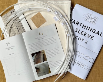 May include: A white fabric kit for making a Farthingale Sleeve Cut 2. The kit includes instructions, fabric, and plastic boning. The instructions include a diagram of the sleeve and steps for cutting and sewing.