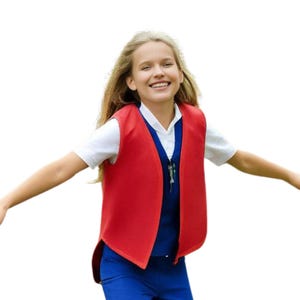 May include: A red vest with a white shirt underneath and blue pants. The vest has a rounded shape and is worn over a blue shirt. The person is smiling with their arms outstretched.