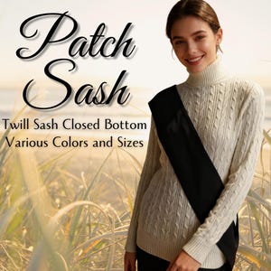 May include: A woman wearing a cream-colored cable-knit turtleneck sweater with a black twill sash. The image includes the text "Patch Sash" and "Twill Sash Closed Bottom Various Colors and Sizes".