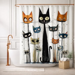 May include: A whimsical shower curtain featuring a cartoon illustration of various cats with different colors and expressions. The cats have long, thin bodies and are set against a white background with black splatters. The curtain is hanging in a bathroom.