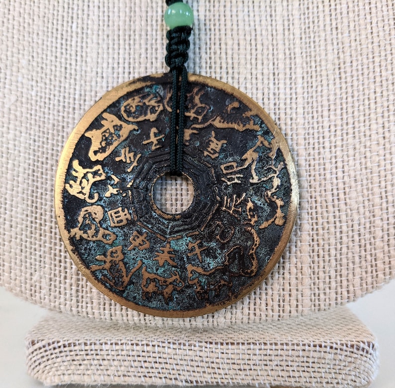 Hand knotted pendant necklace with Vintage bronze coin.