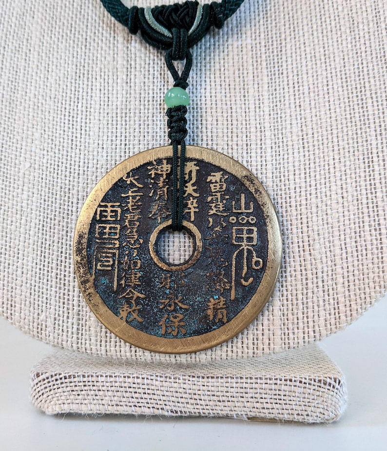 Hand knotted pendant necklace with Vintage bronze coin.