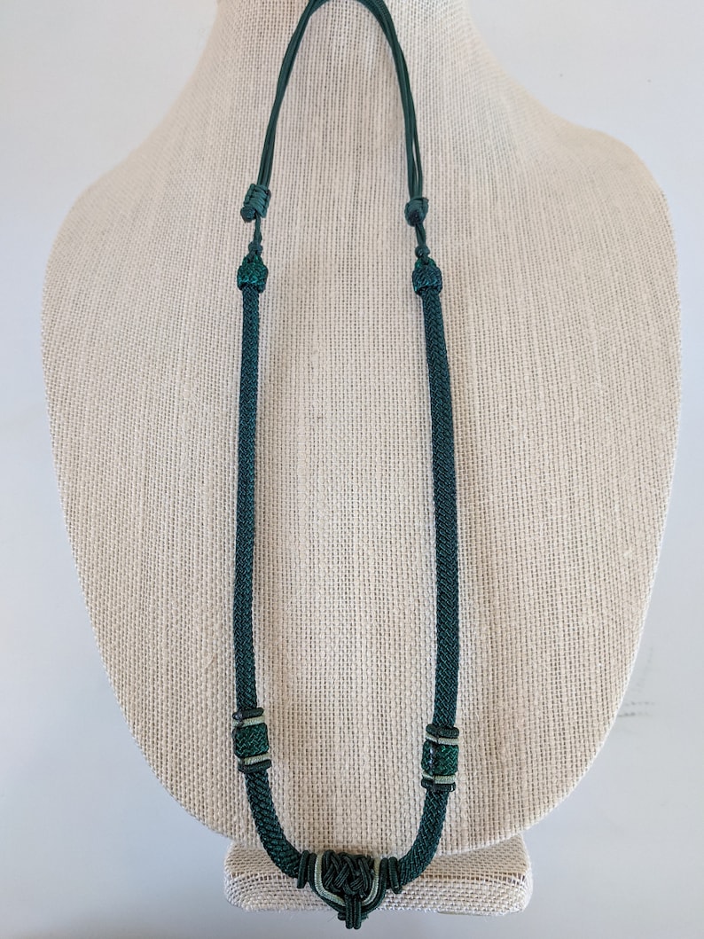Hand knotted pendant necklace with Vintage bronze coin.