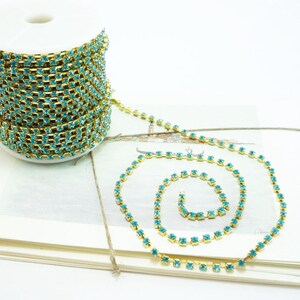 Gold Rhinestone Chain, Aquamarine Blue Crystal, (3mm / 1 Yard Qty)