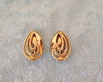 Vintage Crown Trufari Goldtone Clip Earrings in a Crescent Swirl Design, 1980's to 1990's