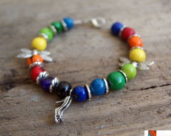 Hand crafted rainbow bracelet acai seeds  hand made with charms dragonfly shoes  black brown green yellow orange red purple colour gift