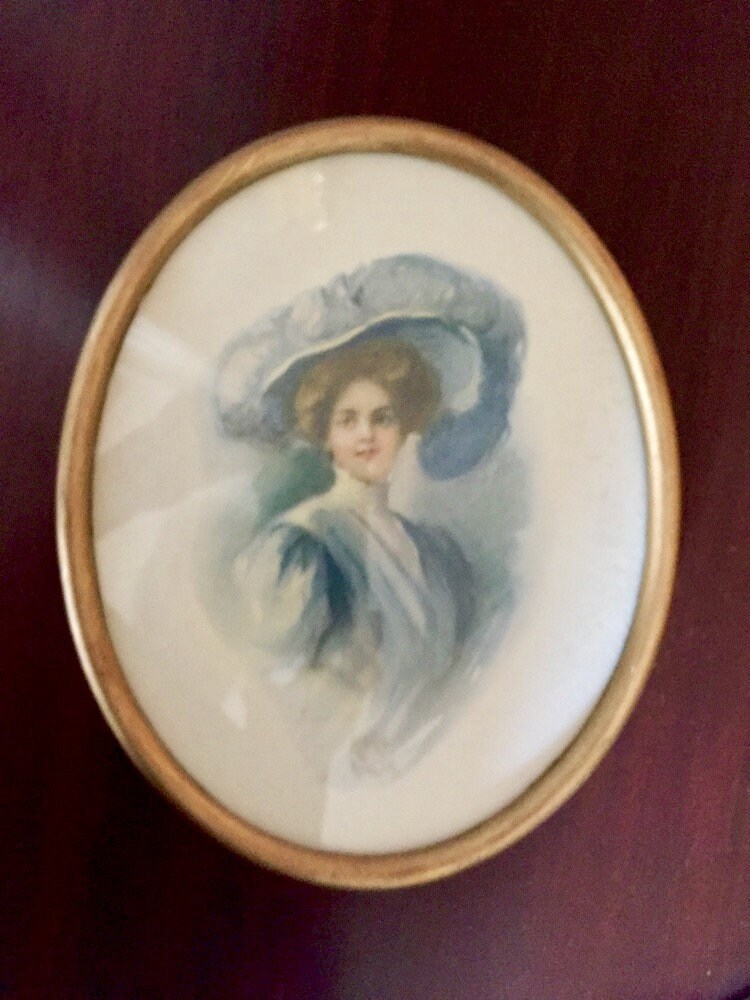 lady in blue hat painting