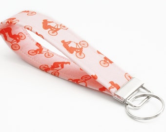 BMX Key Fob - Orange Bikes on Light Pink - 5 Inch Key Ring - Short Key Chain - Cute Wristlet Lanyard - Keychain for Women - BMX Mom Gift