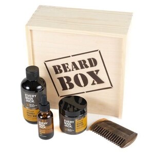 May include: A wooden box labeled "BEARD BOX" containing a beard care set. The set includes a bottle of beard wash, a bottle of beard oil, a jar of beard butter, and a wooden comb.