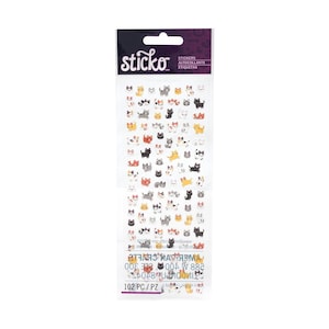 May include: A sheet of stickers featuring various cartoon cat designs in black, white, gray, and yellow. The stickers are on a clear backing with the brand name "sticko" at the top. The package includes 102 stickers.