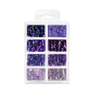 May include: A clear plastic container with eight compartments filled with various shades of purple iridescent sequins.