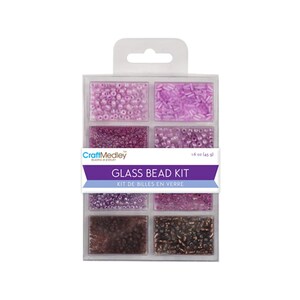 May include: A clear plastic container with 8 compartments filled with various shades of pink and brown glass beads. The container has a label that reads "CraftMedley Beading & Jewelry Glass Bead Kit Kit de Billes en Verre 16 oz (459 g)"