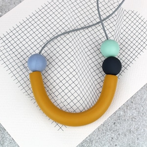 Ochre Curve Necklace: Memphis Milano Inspired Geometric Statement Necklace, Adjustable Length, Leather Cord