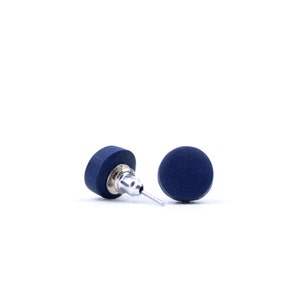 May include: A pair of dark blue stud earrings with silver posts.