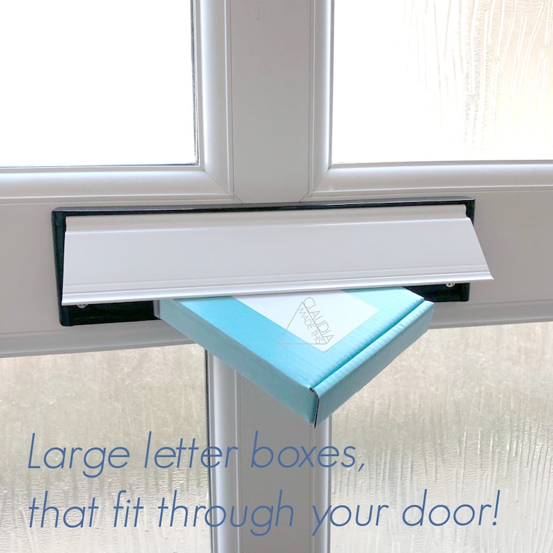 May include: A light blue box with the text "CLAUDIA MADE THIS" in white lettering is being delivered through a white mailbox.