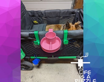 May include: A black wagon with a green handle and a pink cup holder. A dog is lying in the wagon. The text "Life is a Puzzle 3D, LLC" is printed on the bottom of the image.