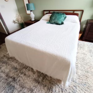 May include: A set of three ceramic mugs with a speckled, matte finish. The mugs are in shades of cream, light gray, and dark gray. Each mug has a simple, minimalist design, perfect for coffee or tea.