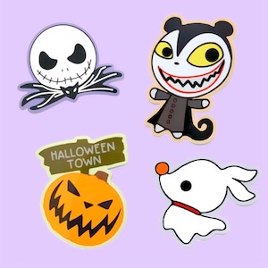 May include: Four Halloween themed stickers featuring Jack Skellington, Oogie Boogie, Zero the Ghost Dog, and a jack-o-lantern with the words "Halloween Town" on a sign.