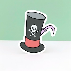 May include: A black and white sticker of a pirate hat with a skull and crossbones design. The hat has a red band and a pink feather.